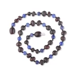 Colorful beaded necklace in purple and blue with textured and smooth beads, elegant and artistic design.