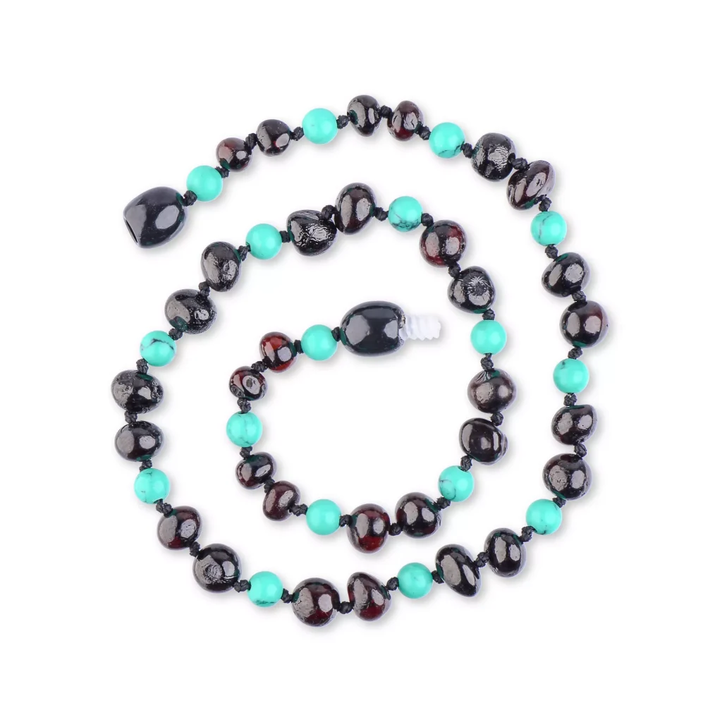 Handmade black and turquoise bead necklace with focal bead, stylish and versatile jewelry accessory.