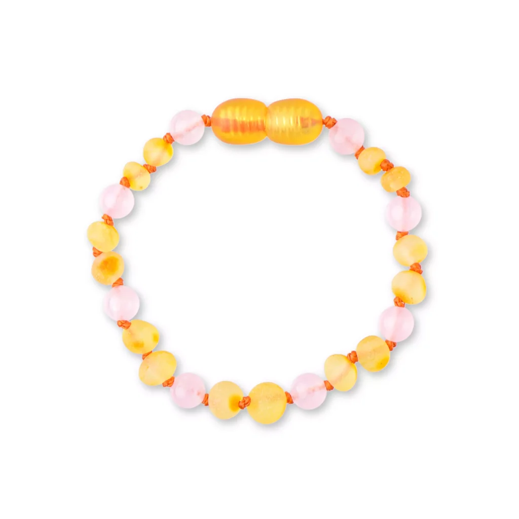 Colorful pink and yellow beaded bracelet with glossy, lightweight design, perfect for casual or festive wear.