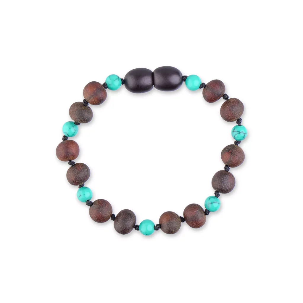 Beaded bracelet with wooden, turquoise, and oval dark glossy beads, handcrafted for versatile style.