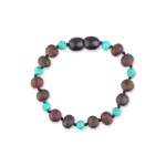 Beaded bracelet with wooden, turquoise, and oval dark glossy beads, handcrafted for versatile style.