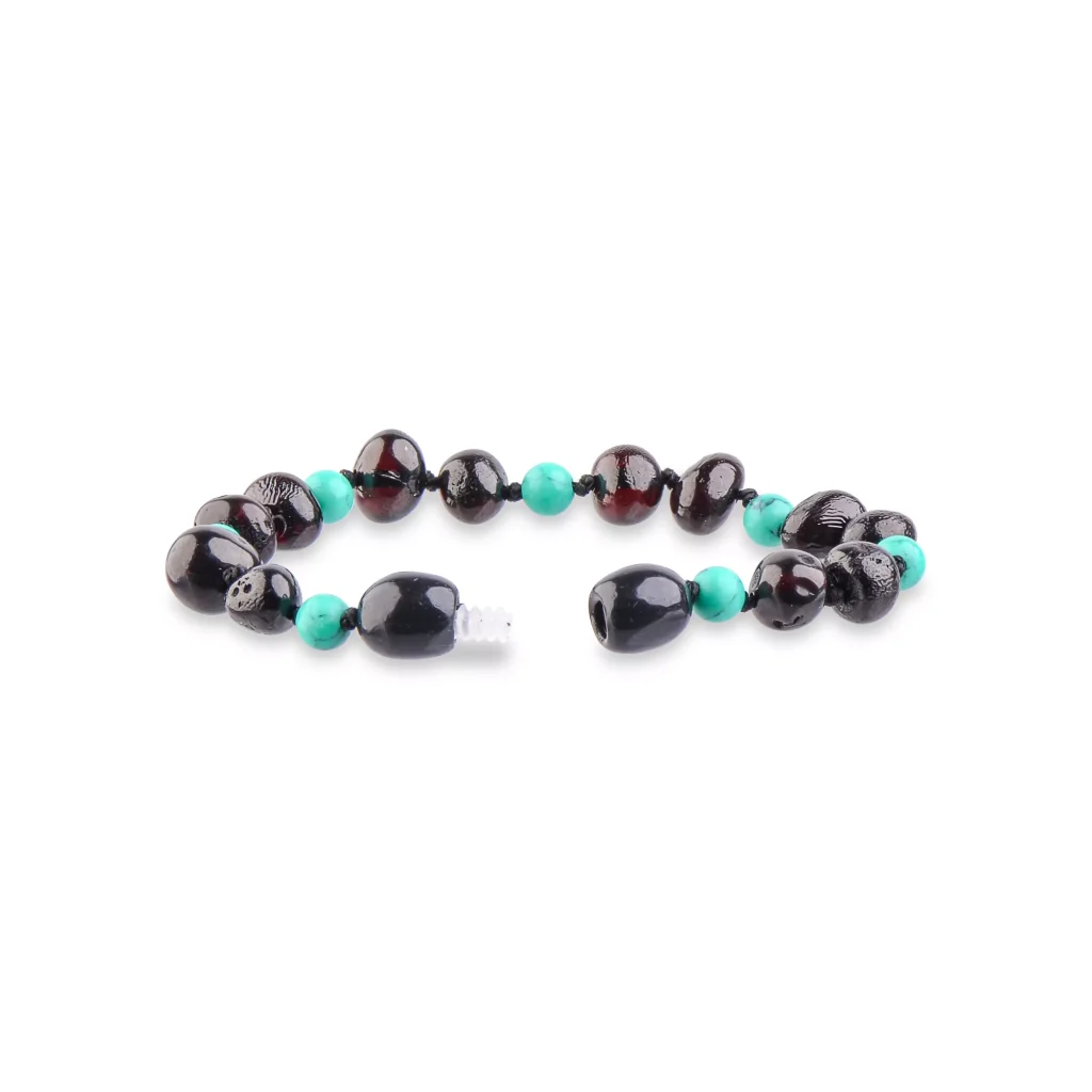 Handmade bracelet with dark almond beads and vibrant turquoise accents for stylish elegance.