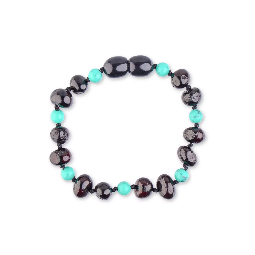Colorful black and turquoise beaded bracelet with glossy and matte finishes, stylish and versatile accessory.