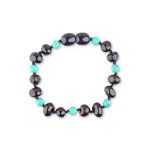 Colorful black and turquoise beaded bracelet with glossy and matte finishes, stylish and versatile accessory.