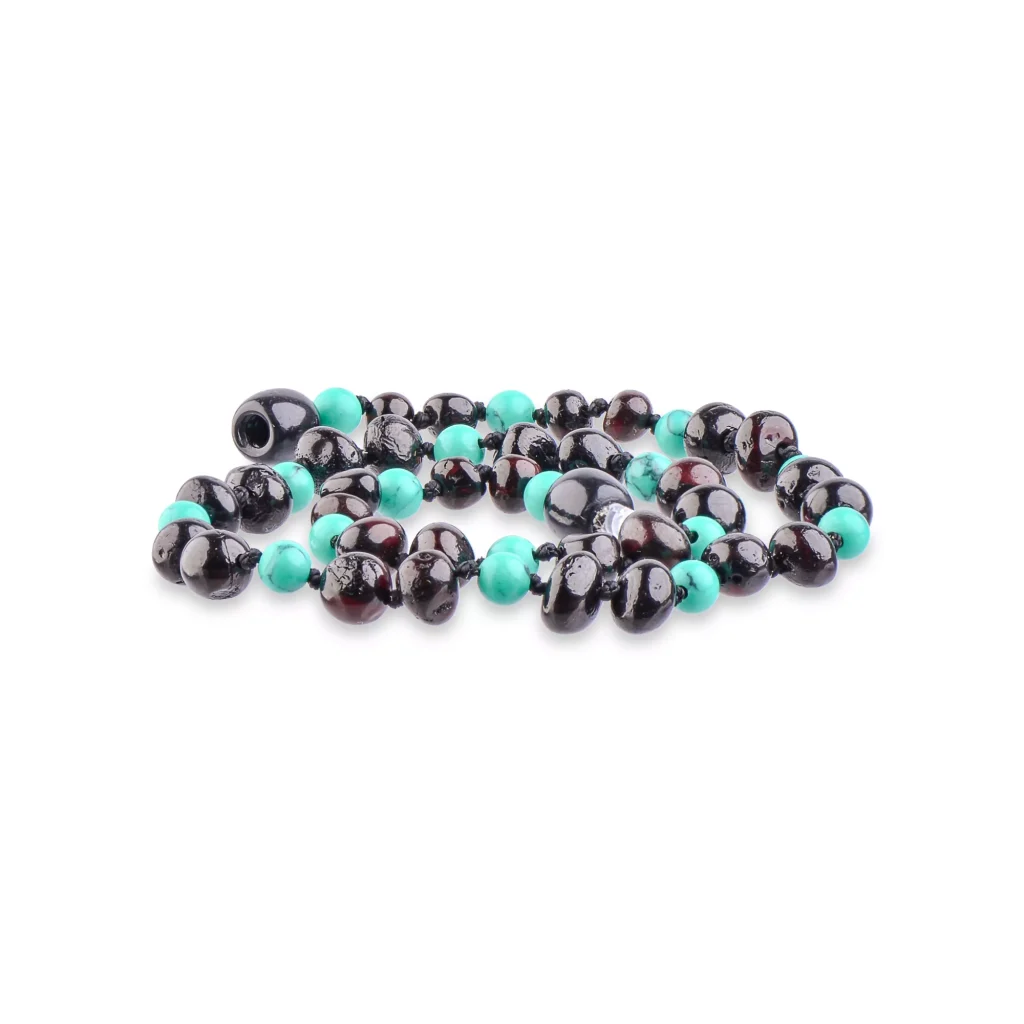 Vibrant turquoise and glossy dark beads in a stylish, handcrafted jewelry piece.