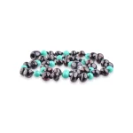 Vibrant turquoise and glossy dark beads in a stylish, handcrafted jewelry piece.