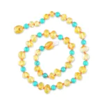 Vibrant handmade Baltic amber and turquoise necklace with colorful, glossy bead design.