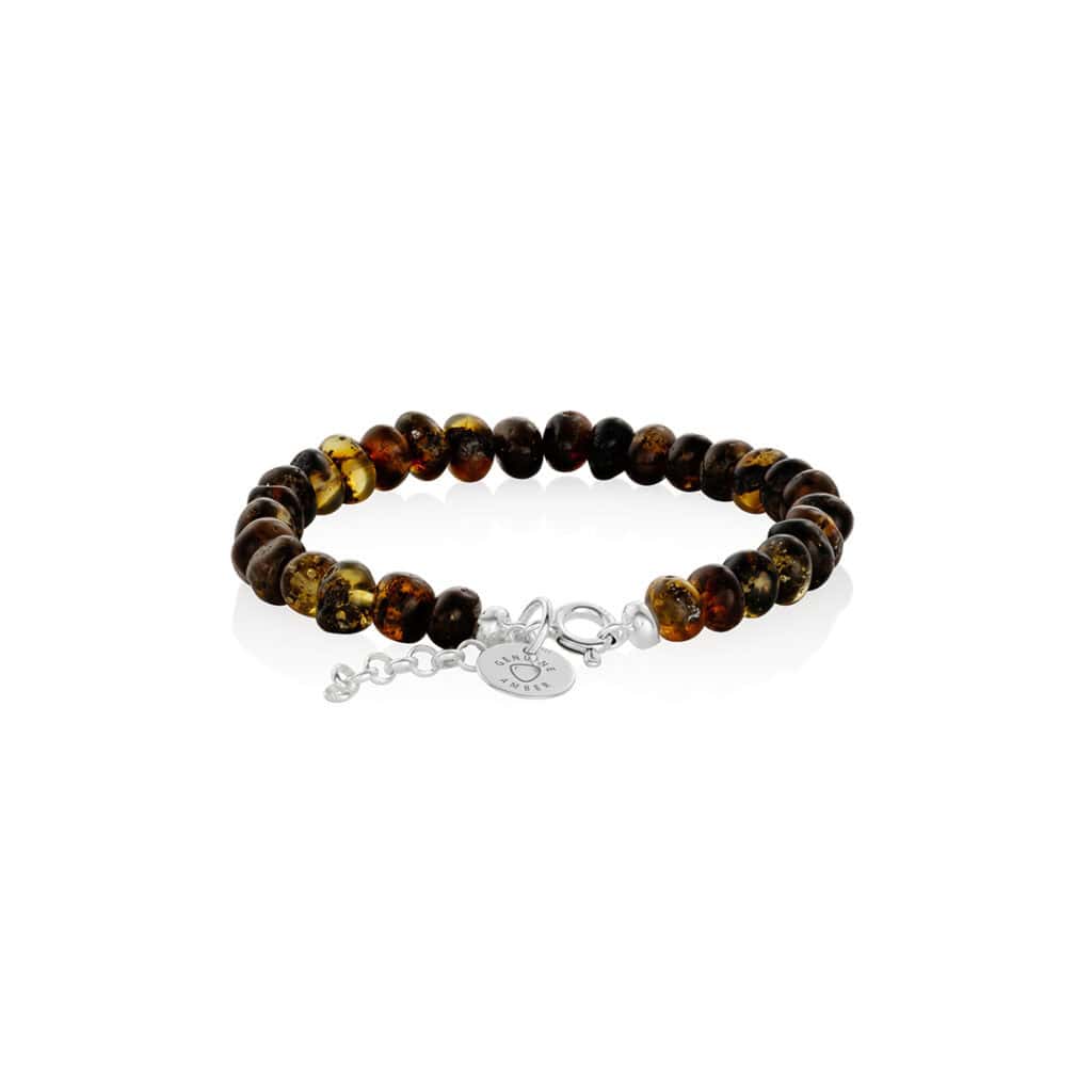 Polished amber bracelet with silver clasp and adjustable extension chain, natural warm tones.