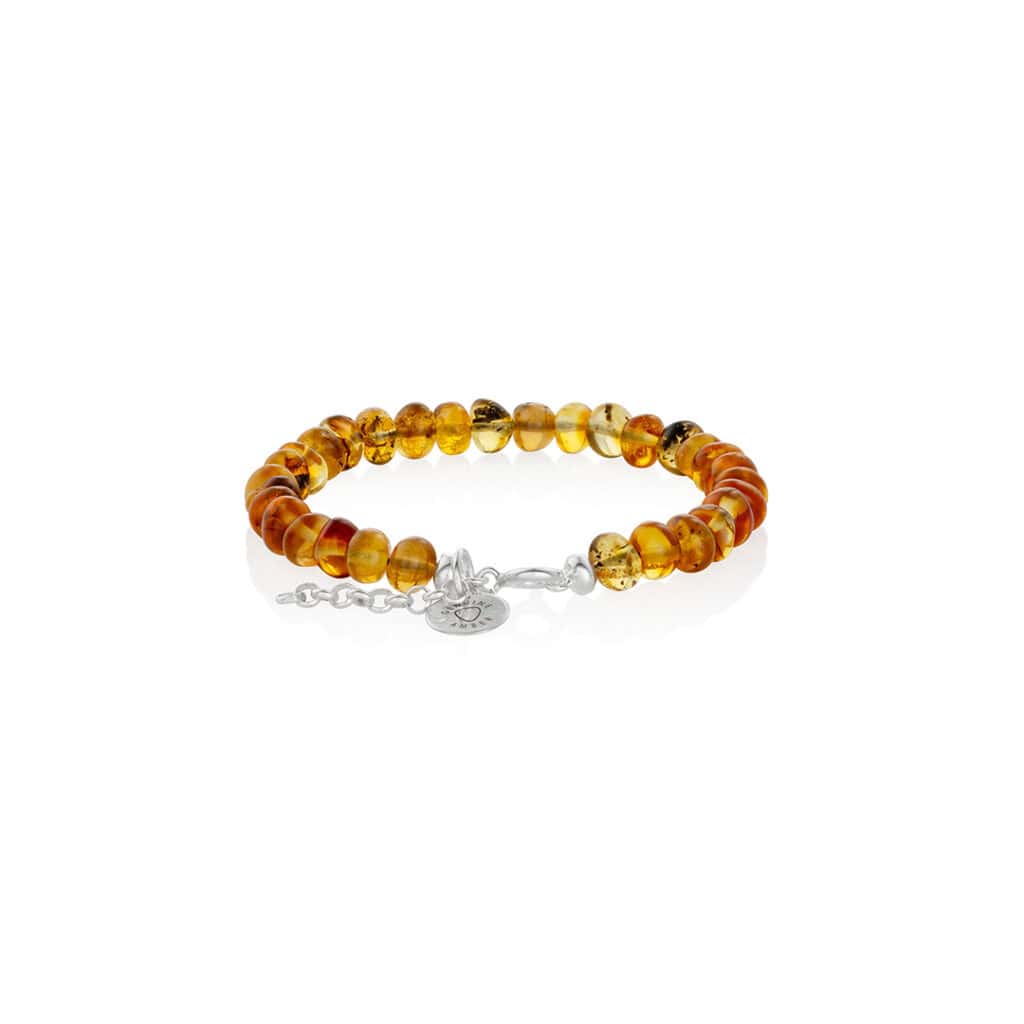 Handcrafted amber bead bracelet with silver clasp, elegant, versatile, and timeless jewelry.