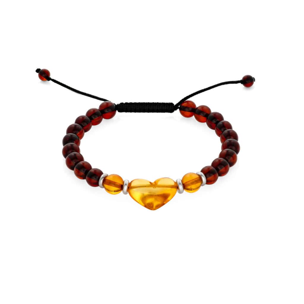 Handmade amber and dark bead bracelet with heart-shaped amber centerpiece and adjustable black cord.