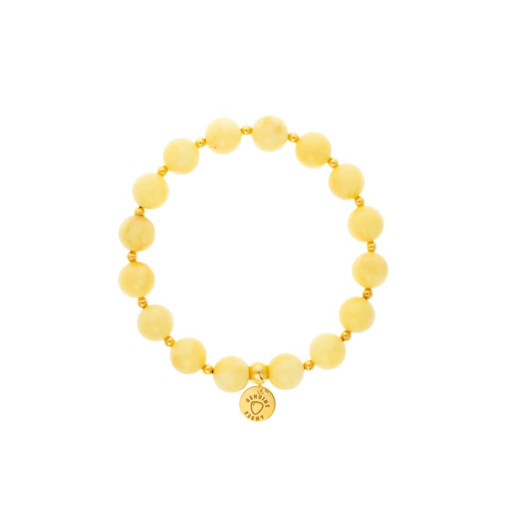Bright yellow beaded bracelet with gold accents and a central engraved charm, elegant and cheerful.