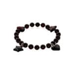 Elegant dark amber bracelet with star and heart charms, versatile for casual or formal wear.