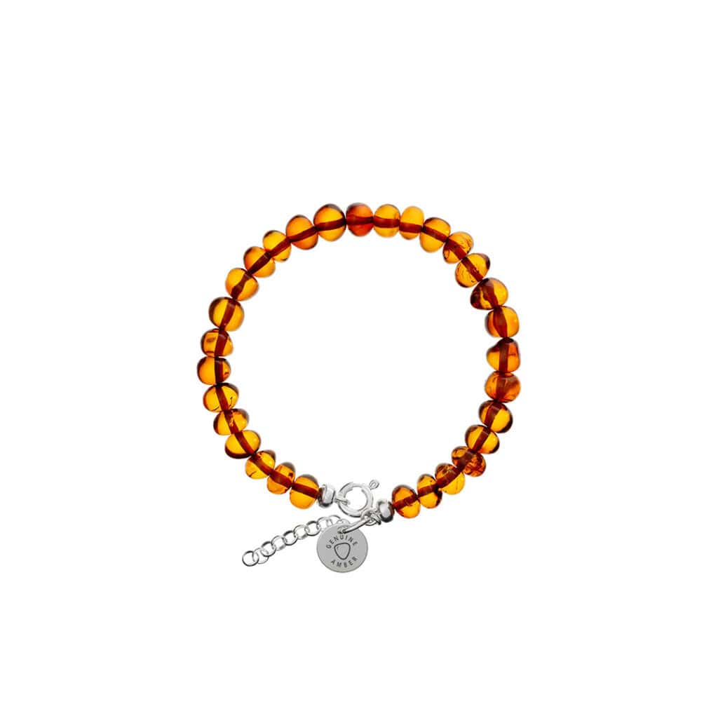 Polished amber bead bracelet with silver clasp, handcrafted, natural Baltic amber, elegant and adjustable.