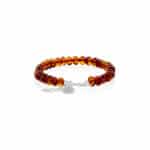 Elegant amber bead bracelet with silver clasp, handcrafted, warm cognac tones, versatile jewelry accessory.