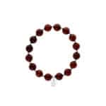 Elegant Baltic amber beaded bracelet with black spacer beads and intricate charm pendant.