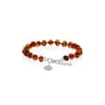 Handmade amber bracelet with silver accents and adjustable chain for elegant, natural style.
