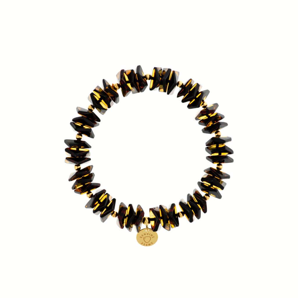 Handmade black and amber gemstone bracelet with charm, versatile and elegant jewelry accessory.