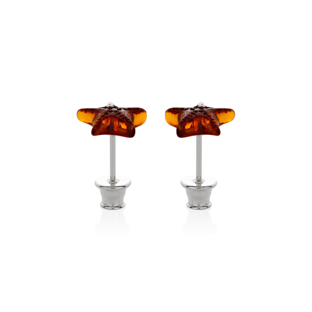 Close-up image of a pair of genuine amber earrings, showcasing their warm, golden-orange hue with natural inclusions. The earrings have a smooth, polished surface, highlighting the organic beauty of the amber, set in simple yet elegant silver clasps. The intricate details of the fossilized resin are visible, giving each piece a unique and timeless appeal.