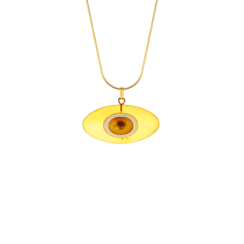 Baltic amber pendant is oval in shape with a spider in the center, gold plated sterling silver chain