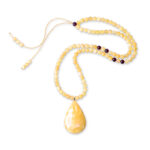 A genuine amber necklace featuring butter-colored beads with a soft, creamy yellow tone. The beads are smooth and slightly translucent, with delicate inclusions that highlight the natural origin of the amber. The necklace exudes a warm, gentle glow, showcasing the unique and organic beauty of the butter-colored amber.