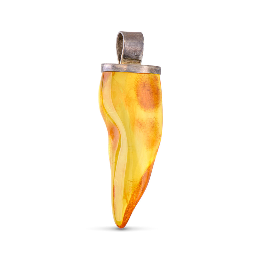 A close-up image of a genuine amber pendant showcasing its warm, golden hues. The amber is transparent with natural inclusions, capturing its organic beauty. The pendant is encased in a silver or gold frame, adding elegance to the raw, fossilized resin. The smooth surface of the amber reflects light, highlighting its natural glow and intricate details. This timeless piece of jewelry hangs delicately from a chain, blending nature and craftsmanship.