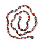 A collection of real amber necklaces featuring beads in a variety of shades from deep honey to creamy butter. Or cherry-colored. Each necklace showcases the natural beauty of amber with smooth, polished beads that highlight unique inclusions and subtle color variations. Necklaces are elegant, offering a timeless and eco-friendly accessory option.