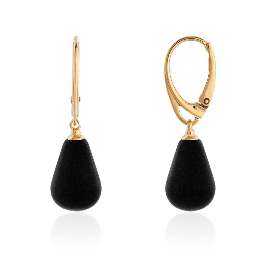 Close-up image of genuine black amber earrings, showcasing their deep, rich color with subtle hints of brown and natural inclusions. The polished amber stones are set in elegant silver settings, emphasizing the rare and mysterious beauty of black amber. The smooth, glossy surface enhances their sophisticated and bold appearance.