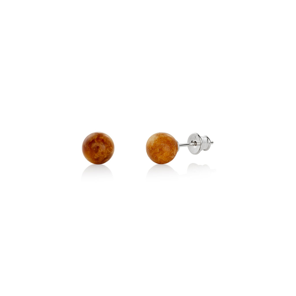 A pair of genuine amber earrings with translucent, warm golden-orange stones, showcasing natural inclusions. The amber is set in delicate silver or gold, highlighting its organic beauty. The earrings have a polished surface that reflects light, emphasizing the rich color variations and natural patterns within the amber. The earrings are lightweight, elegant, and exude a timeless, earthy charm, perfect for both casual and formal wear.