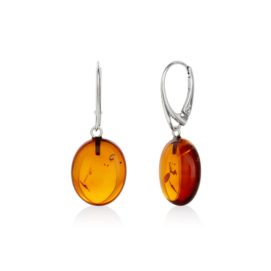 A pair of genuine amber earrings with translucent, warm golden-orange stones, showcasing natural inclusions. The amber is set in delicate silver or gold, highlighting its organic beauty. The earrings have a polished surface that reflects light, emphasizing the rich color variations and natural patterns within the amber. The earrings are lightweight, elegant, and exude a timeless, earthy charm, perfect for both casual and formal wear.