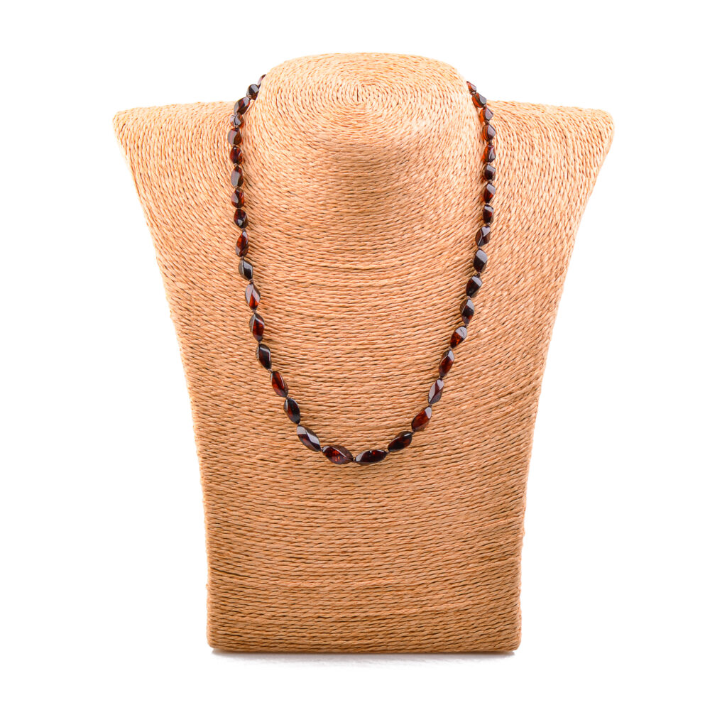 A collection of real amber necklaces featuring beads in a variety of shades from deep honey to creamy butter. Or cherry-colored. Each necklace showcases the natural beauty of amber with smooth, polished beads that highlight unique inclusions and subtle color variations. Necklaces are elegant, offering a timeless and eco-friendly accessory option.