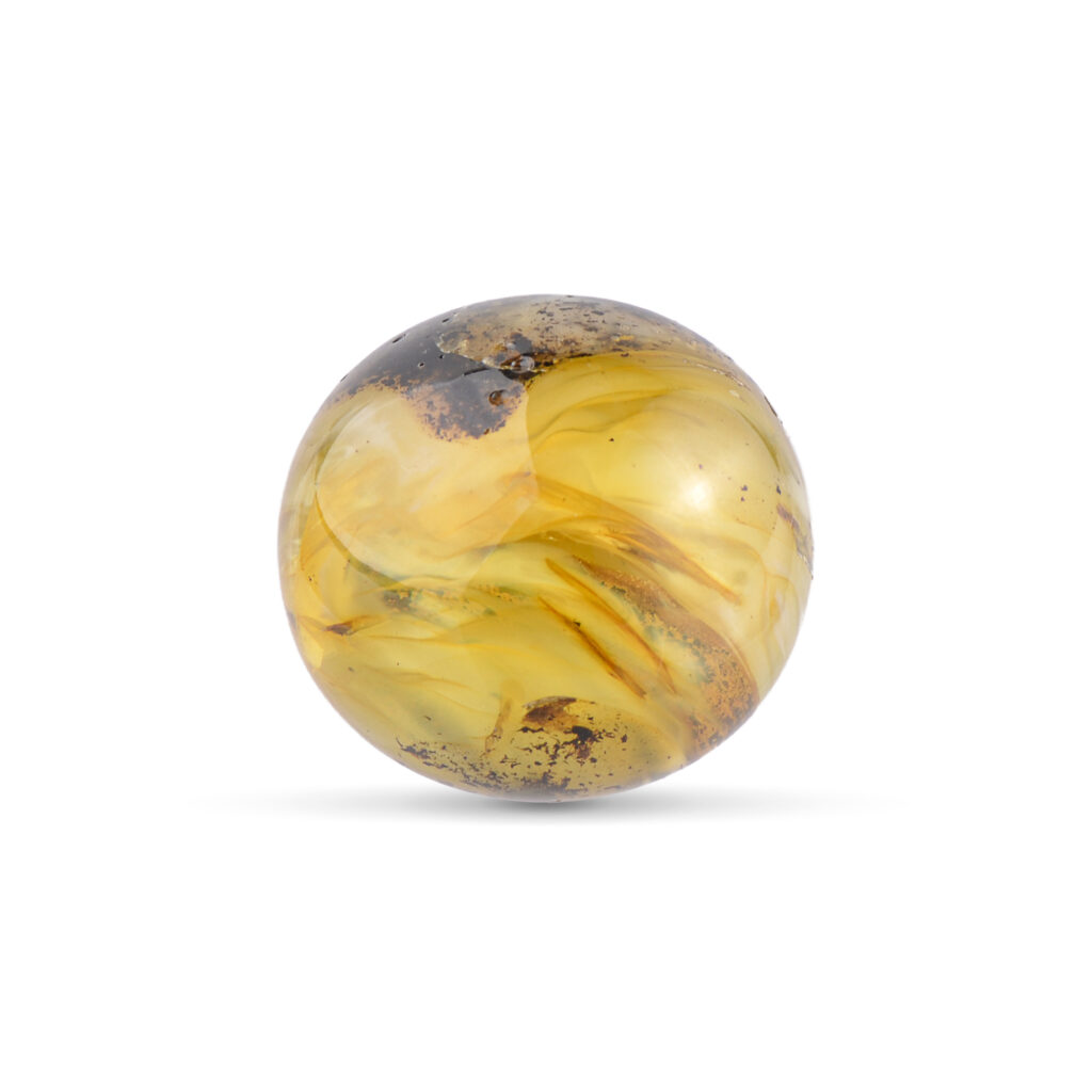 Side view of the green Baltic amber piece, emphasizing its rounded shape and color depth.