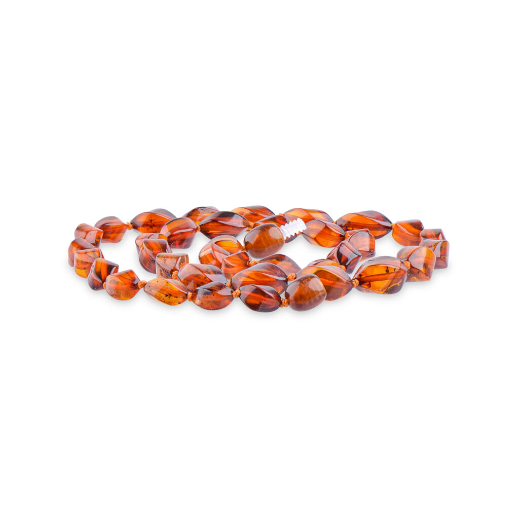 A collection of genuine amber necklaces, featuring beads in various shades from deep honey to creamy butter. Each necklace showcases the natural beauty of amber, with smooth, polished beads that highlight unique inclusions and subtle color variations. The necklaces are elegantly crafted, offering a timeless and organic accessory choice.