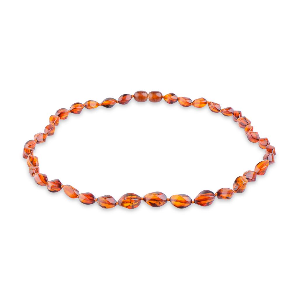 A collection of genuine amber necklaces, featuring beads in various shades from deep honey to creamy butter. Each necklace showcases the natural beauty of amber, with smooth, polished beads that highlight unique inclusions and subtle color variations. The necklaces are elegantly crafted, offering a timeless and organic accessory choice.