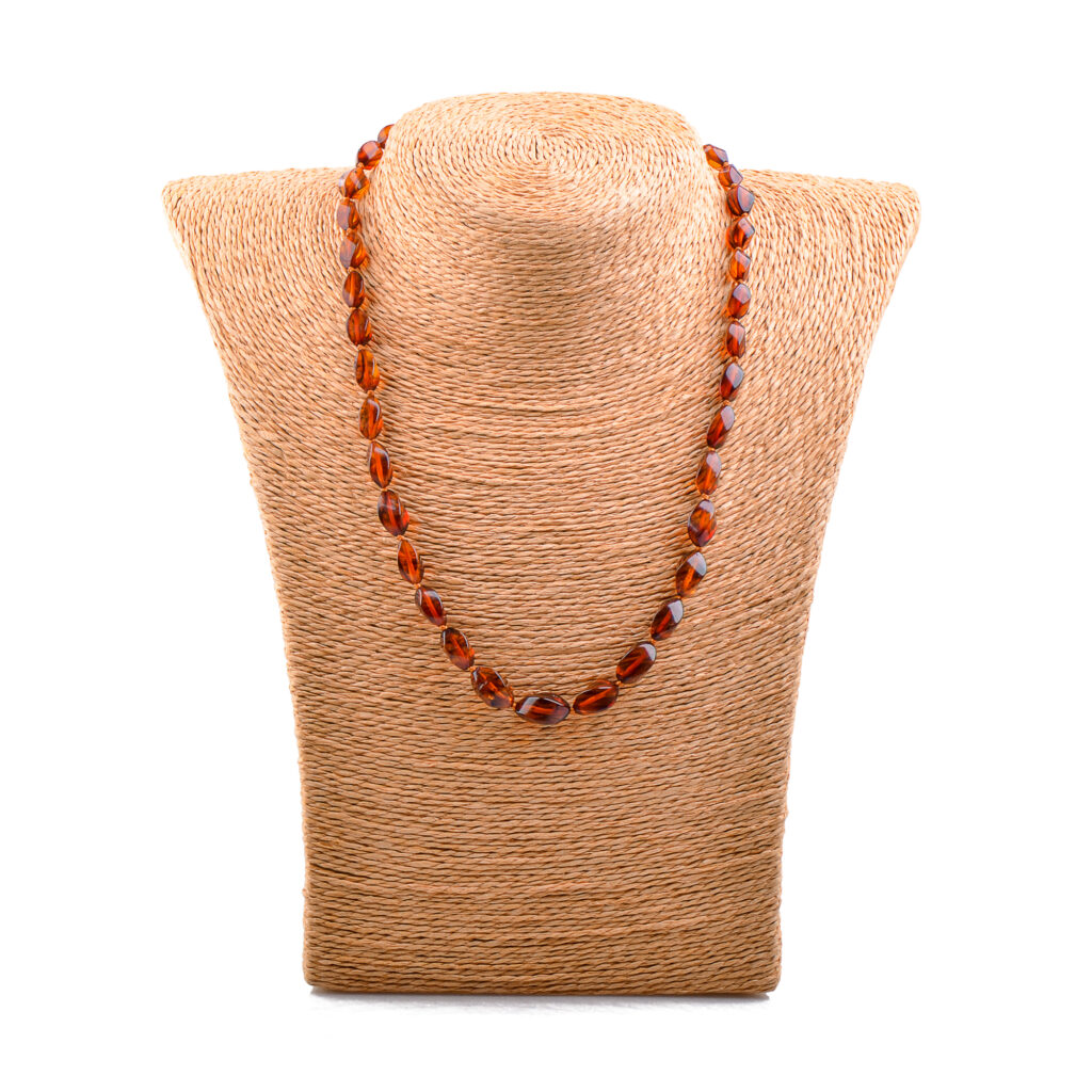 A collection of genuine amber necklaces, featuring beads in various shades from deep honey to creamy butter. Each necklace showcases the natural beauty of amber, with smooth, polished beads that highlight unique inclusions and subtle color variations. The necklaces are elegantly crafted, offering a timeless and organic accessory choice.