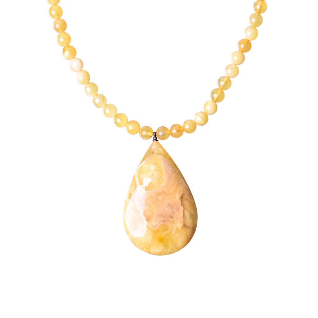 Elegant Baltic amber necklace with yellow beads and marbled teardrop pendant for versatile style.