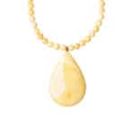 Elegant yellow amber necklace with polished teardrop pendant and matching beaded chain.