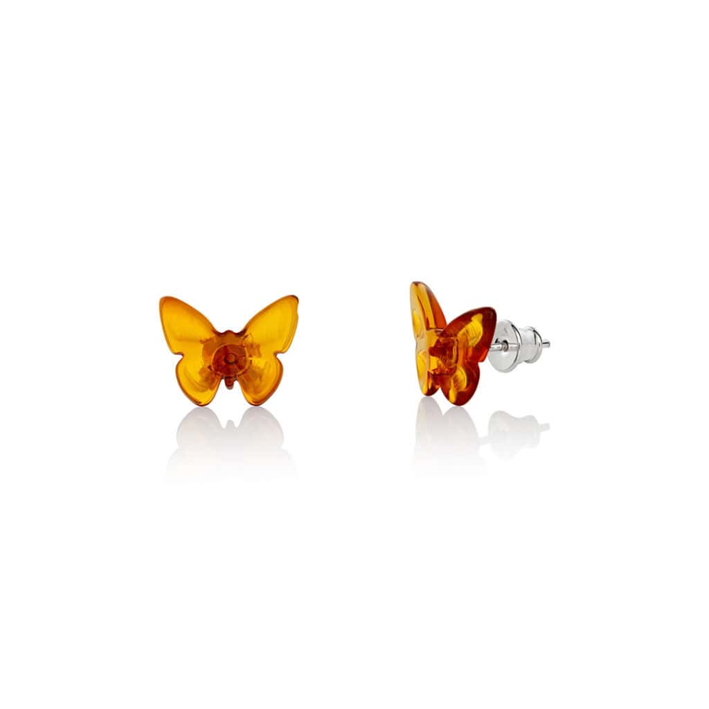 Delicate amber butterfly earrings with sterling silver studs, crafted for elegant, everyday wear.