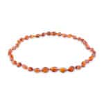 Warm amber beaded necklace with polished oval stones for elegant, timeless style.