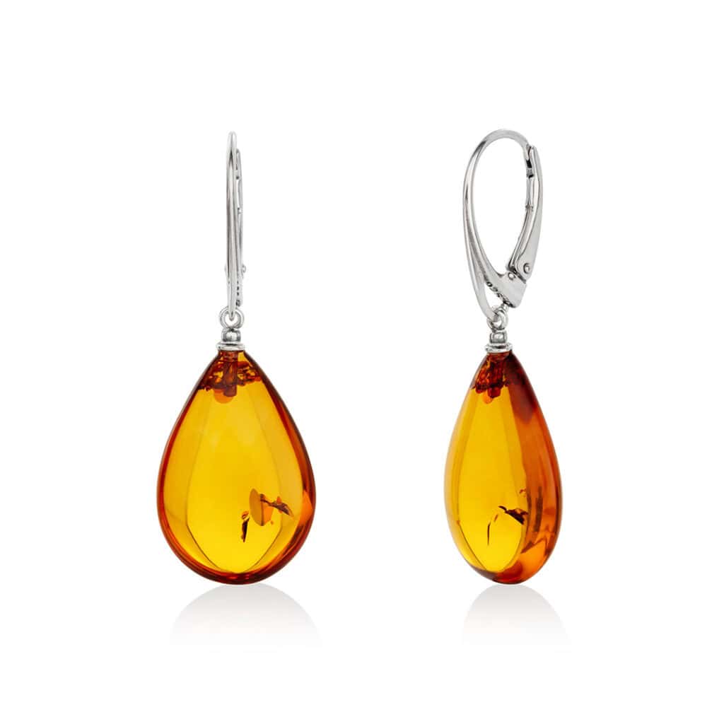 Elegant teardrop amber earrings with sterling silver hooks, warm cognac hues, and natural inclusions.