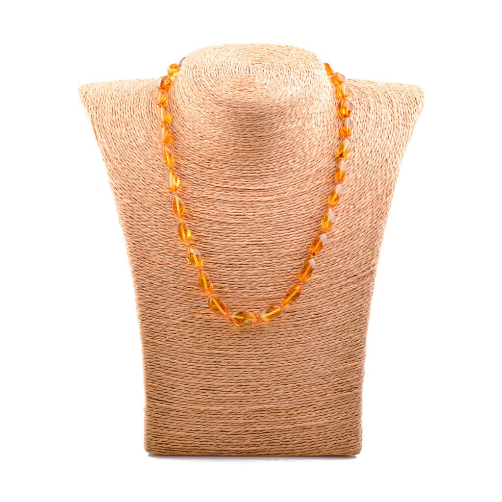 Handmade amber beaded necklace displayed on a neutral linen bust.