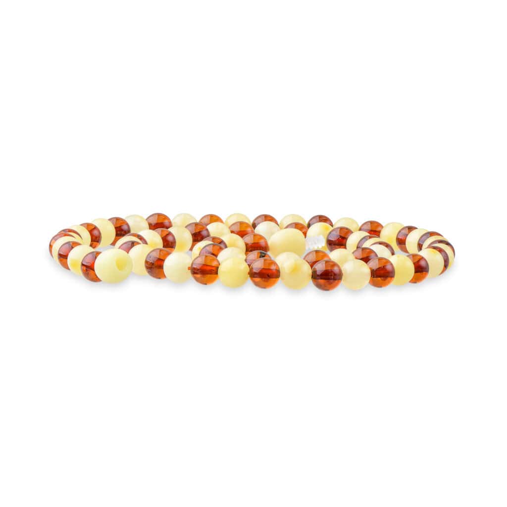 Symmetrical Baltic amber beads in warm orange and beige create a stylish, handcrafted jewelry piece.
