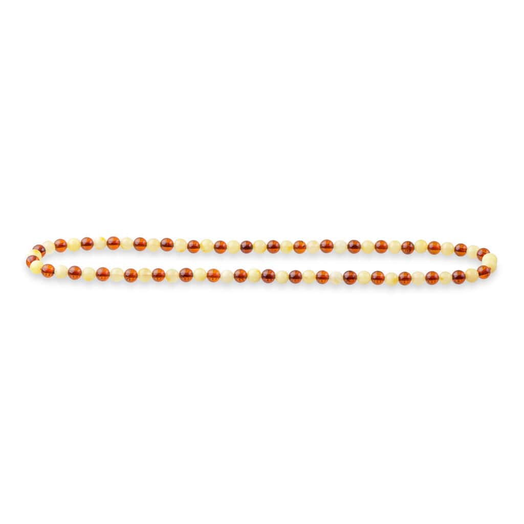 Elegant Baltic amber bead necklace with warm honey and creamy tones, handmade and versatile for any occasion.