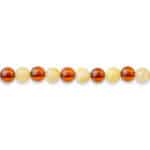 Row of smooth, dual-tone amber beads with glossy finish for jewelry or craft projects.