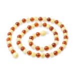 Elegant Baltic amber necklace with alternating amber and creamy beads, timeless and versatile jewelry piece.