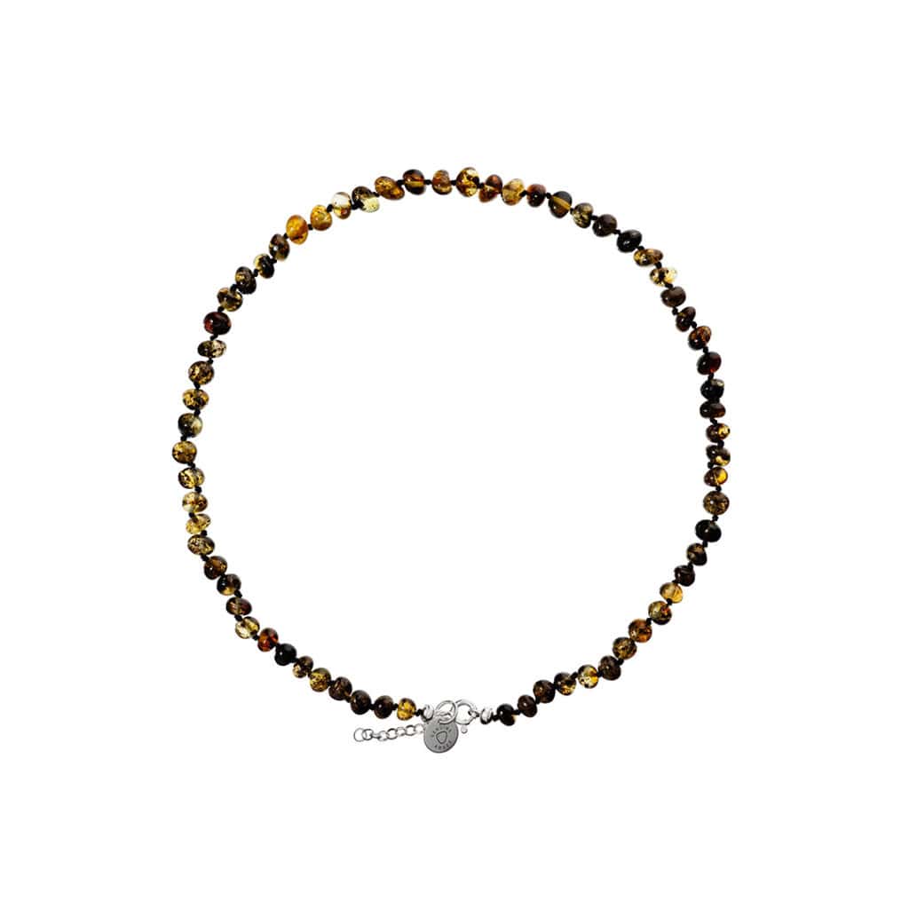 Handmade amber necklace with warm tones and silver clasp, stylish and versatile jewelry piece.