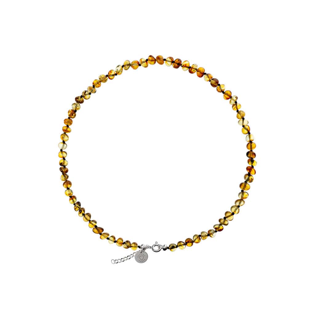 Exquisite Baltic amber necklace with silver clasp, showcasing warm, polished honey tones and handcrafted elegance.
