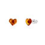 Handcrafted amber heart earrings with silver posts, warm translucent resin, elegant and versatile jewelry.