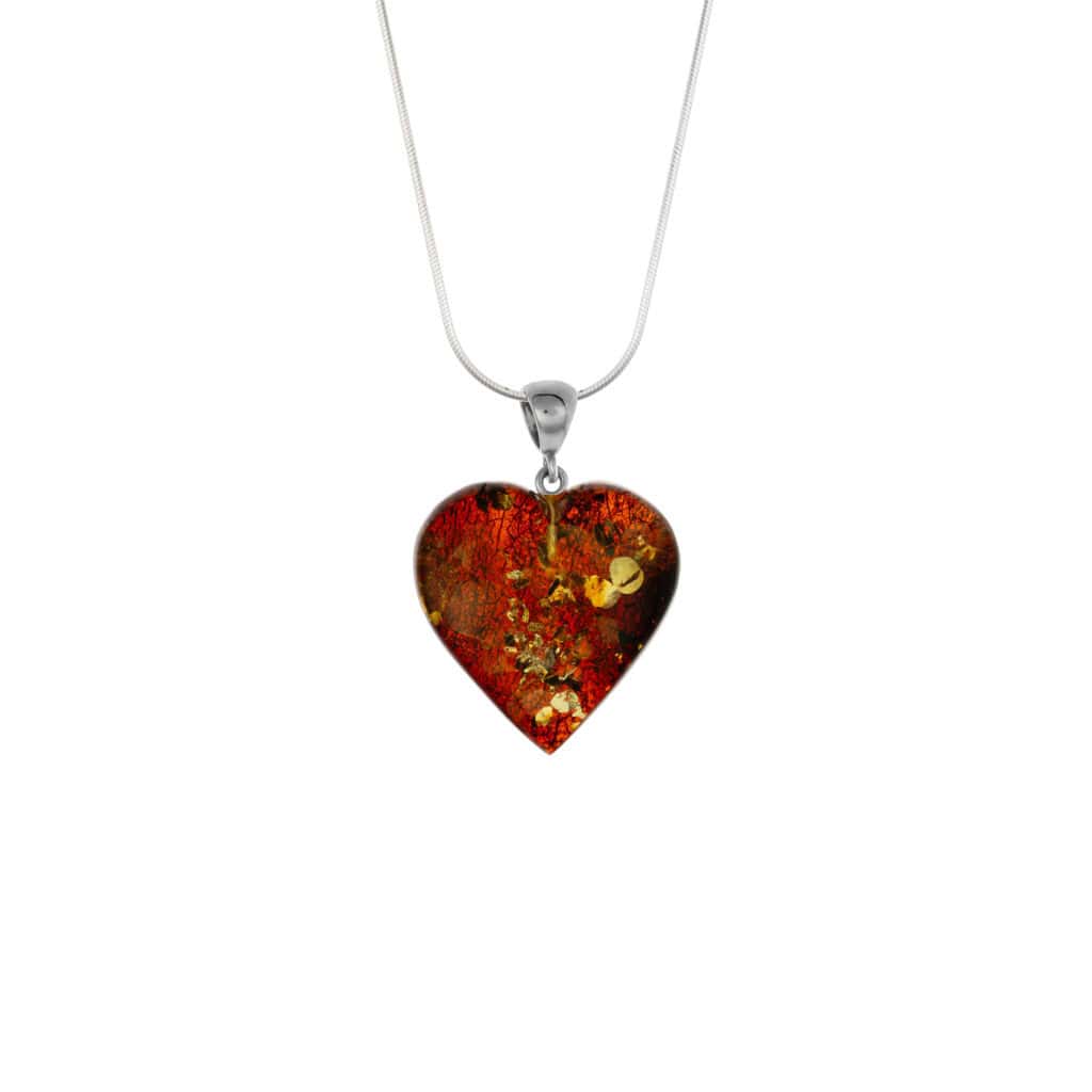 Vibrant Baltic amber heart pendant with floral accents on silver chain, stylish and natural elegance.