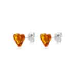 Heart-shaped amber stud earrings with silver settings, vibrant and elegant for everyday or special wear.