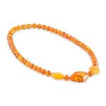 Handmade Baltic amber necklace with honey tones and diverse shaped beads for casual or elegant wear.
